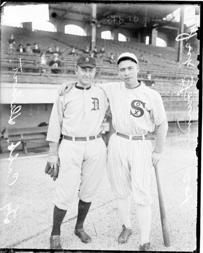 Baseball players Jack Fournier, White Sox, and Ty Cobb, Detroit Tigers, standing on the field at Comiskey Park